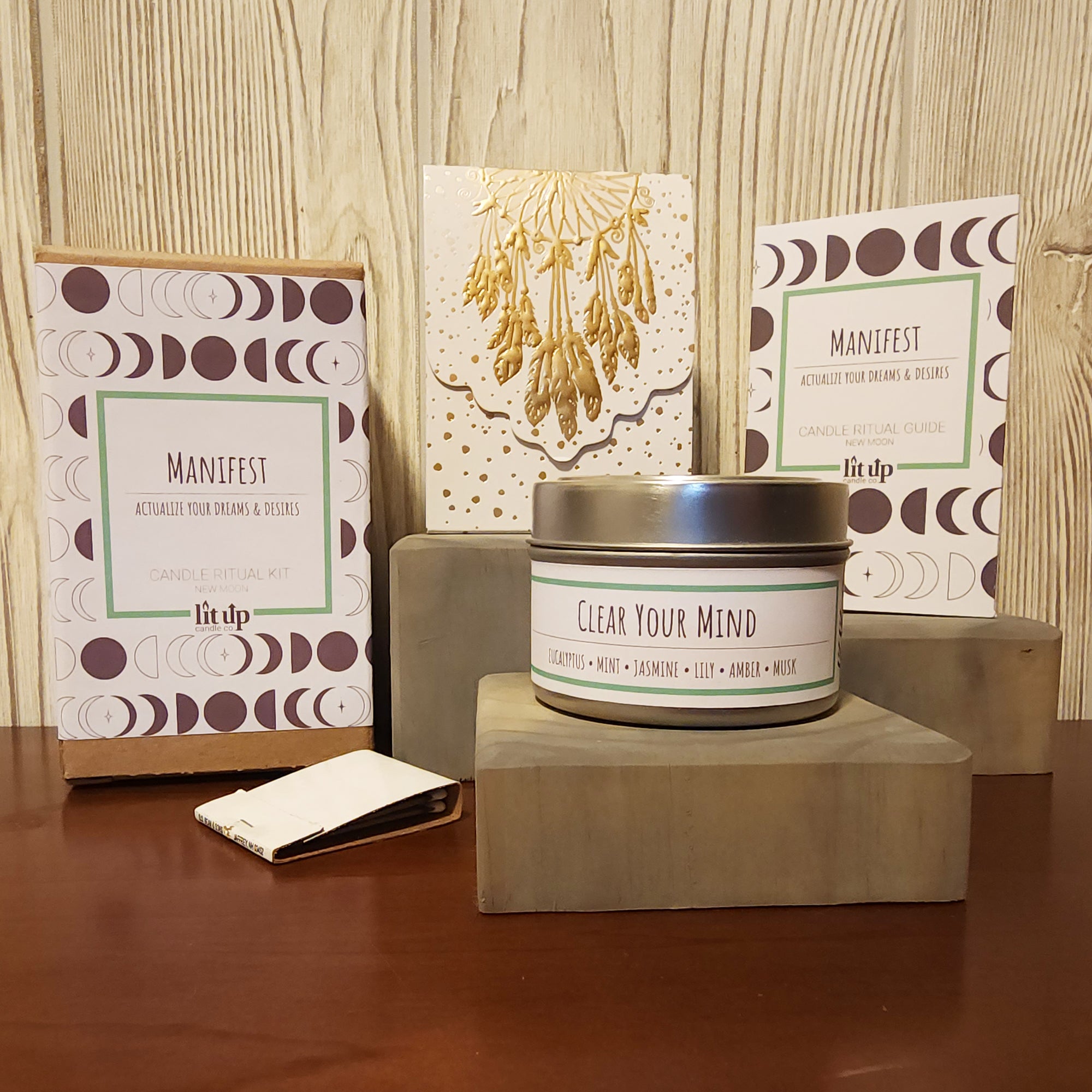 Manifest themed candle ritual kit including Clear Your Mind scented candle, ritual notepad, instructions and matches.