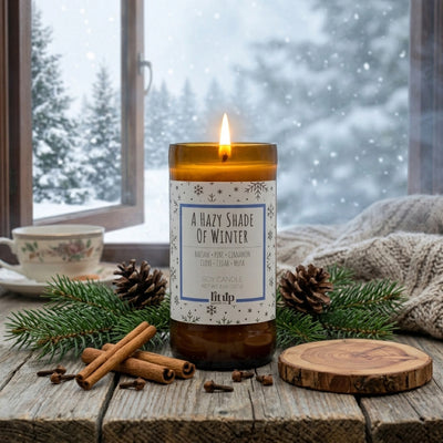 A Hazy Shade of Winter 8 oz. soy candle lit with winter scenery