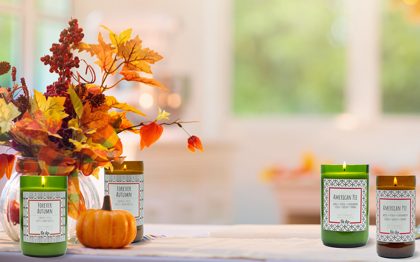 Fall scented candles burning on the counter next to an Autumn bouquet.