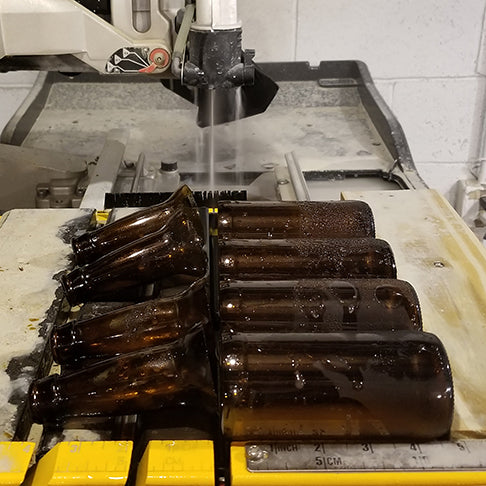 Cut beer bottles on a wet tile saw